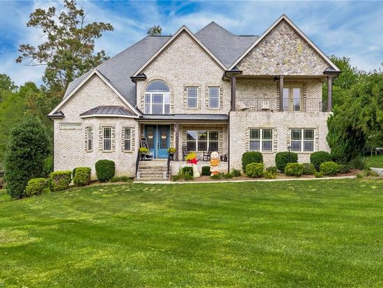 Luxury brick estate home with manicured landscaping sold by Rob Herald Realty in the NC Piedmont Triad