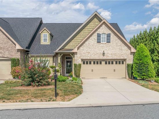 Brick ranch-style home with professional landscaping sold by Rob Herald Realty in the Piedmont Triad